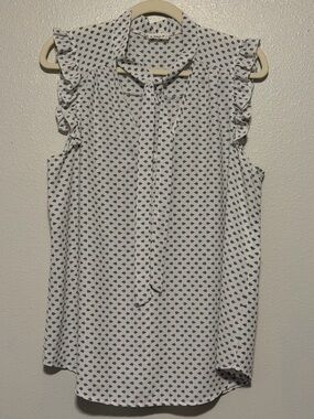 Sleeveless Ruffle Tie-Neck Camisole in White with Black Motif